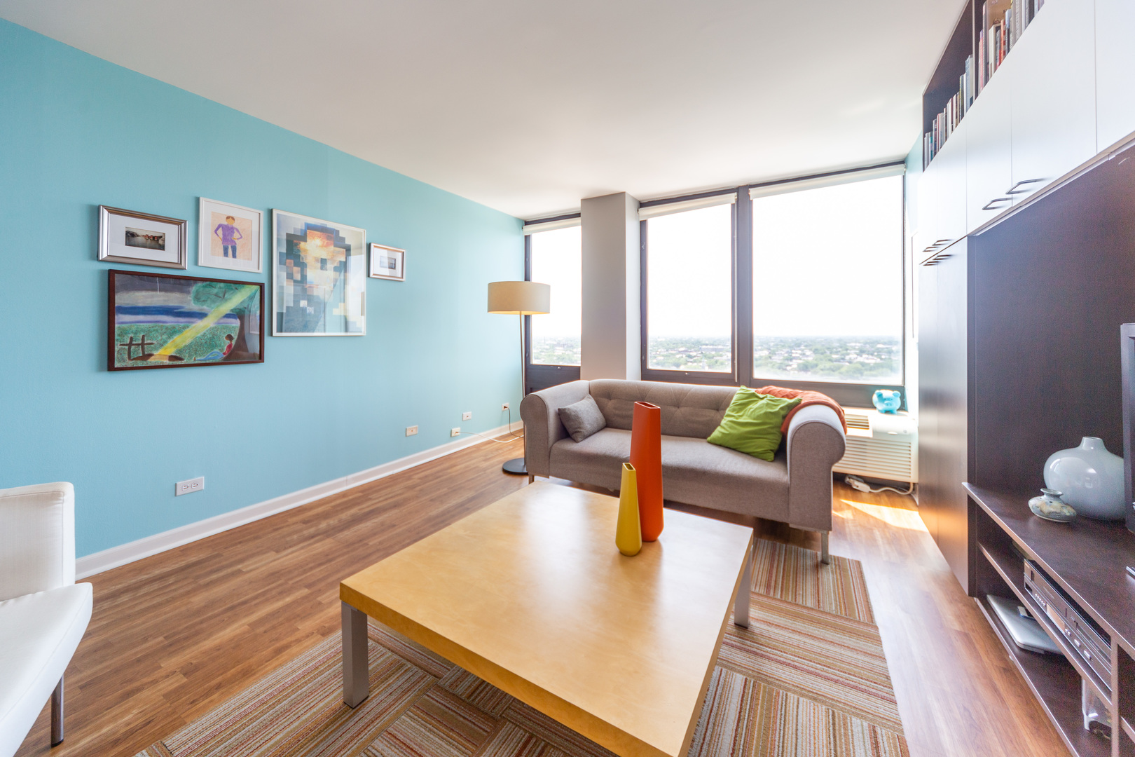 5320 North Sheridan Road, Unit 2401 Chicago, IL 60640 - Photo 4 of 21 a living room with furniture and a large window
