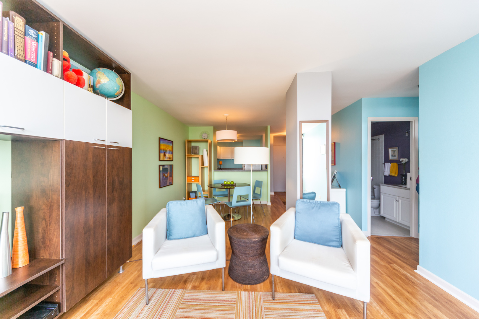 5320 North Sheridan Road, Unit 2401 Chicago, IL 60640 - Photo 7 of 21 a living room with furniture and a wooden floor