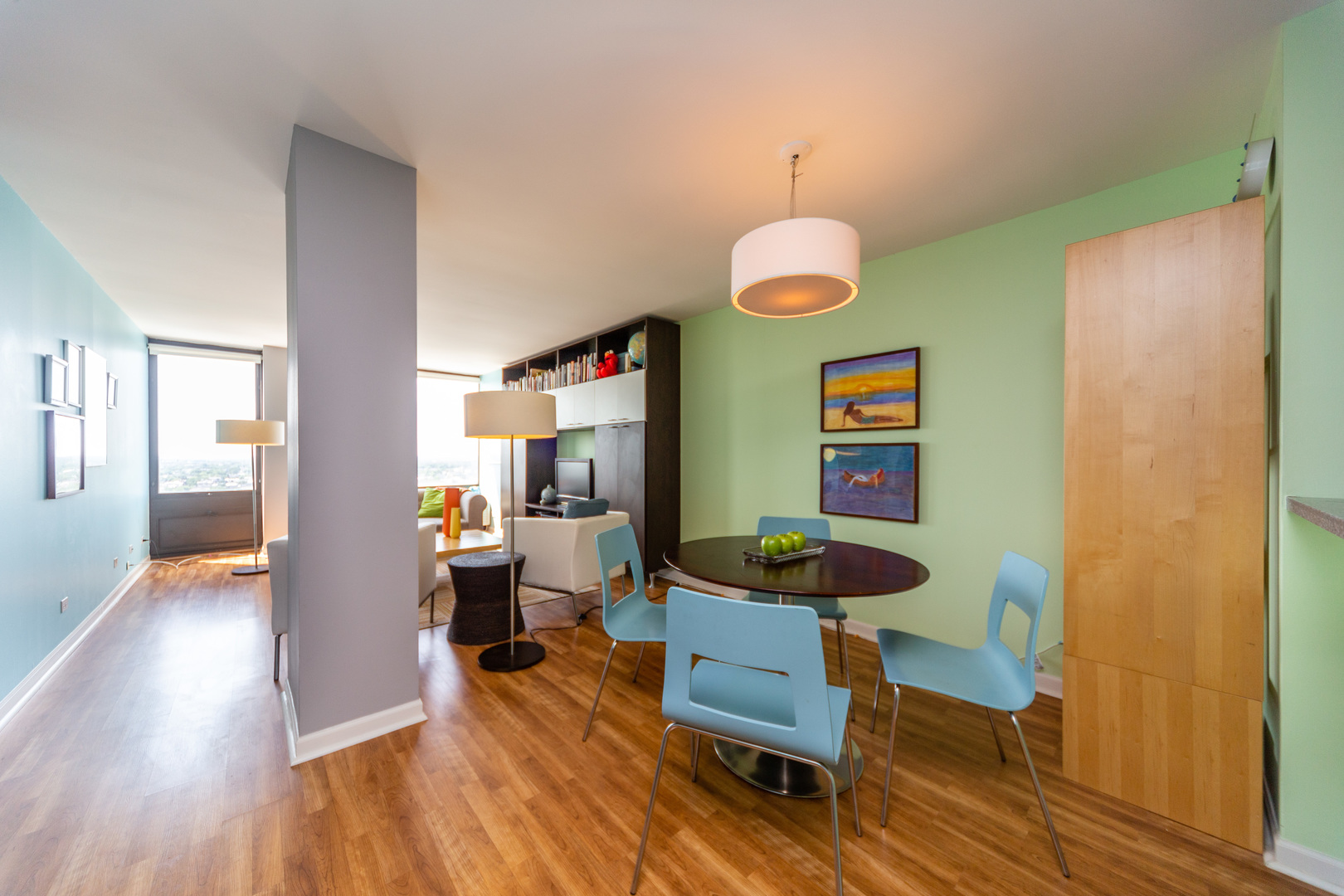 5320 North Sheridan Road, Unit 2401 Chicago, IL 60640 - Photo 8 of 21 a living room with furniture and a wooden floor