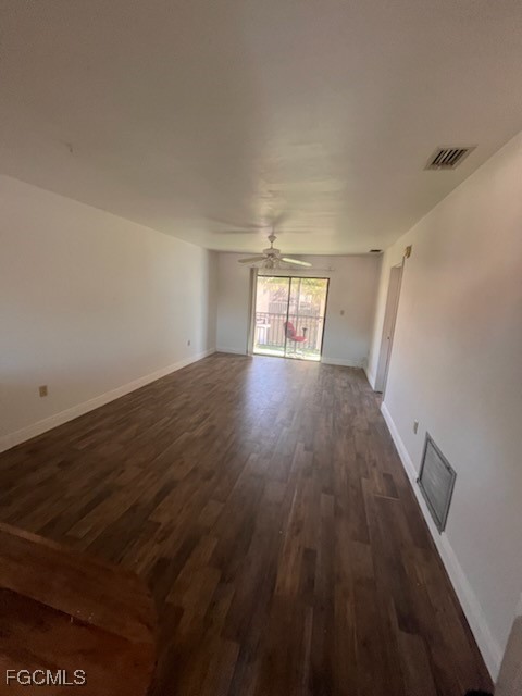 4790 South Cleveland Avenue, Unit 908 Fort Myers, FL 33907 - Photo 6 of 10 wooden floor in an empty room with a window