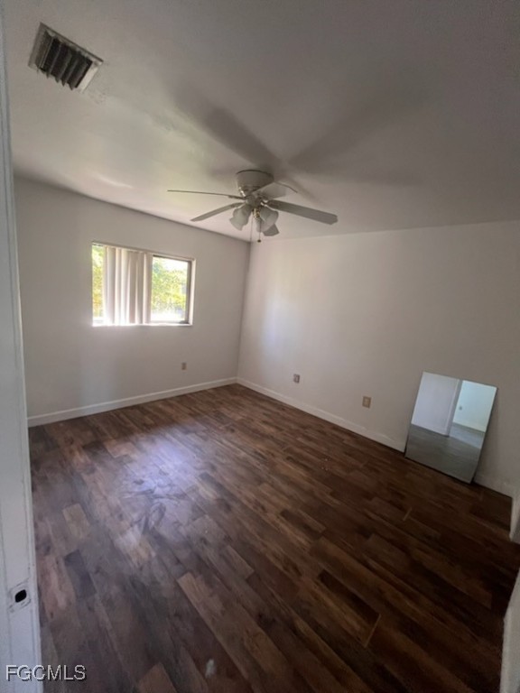4790 South Cleveland Avenue, Unit 908 Fort Myers, FL 33907 - Photo 7 of 10 an empty room with wooden floor and windows