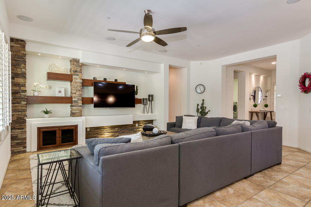 4647 North Aldea Road East Litchfield Park, AZ 85340 - Photo 13 of 49 a living room with furniture and a flat screen tv