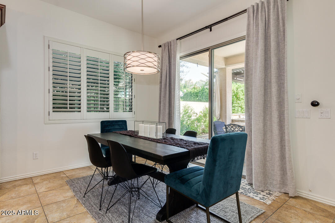 4647 North Aldea Road East Litchfield Park, AZ 85340 - Photo 20 of 49 a view of a dining room with furniture window and outside view