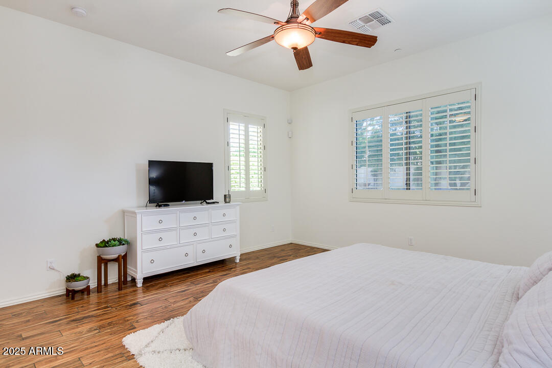 4647 North Aldea Road East Litchfield Park, AZ 85340 - Photo 25 of 49 a bedroom with a bed and a flat screen tv