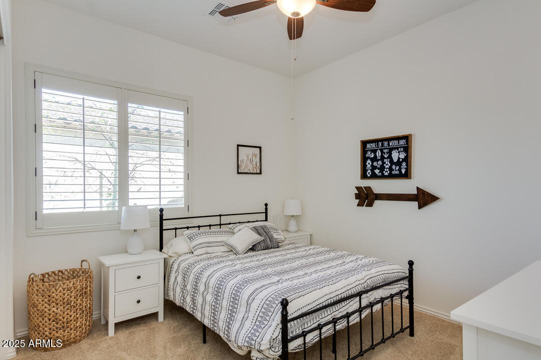 4647 North Aldea Road East Litchfield Park, AZ 85340 - Photo 30 of 49 a bedroom with a bed and a window