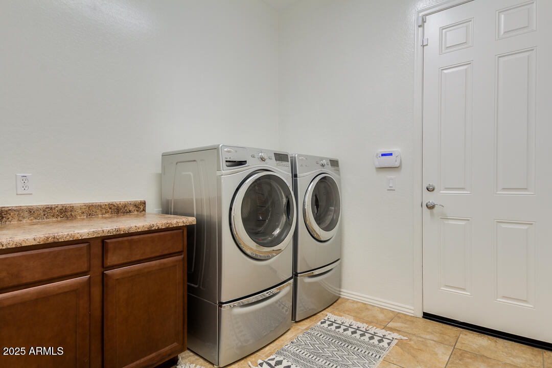 4647 North Aldea Road East Litchfield Park, AZ 85340 - Photo 34 of 49 a utility room with dryer and washer