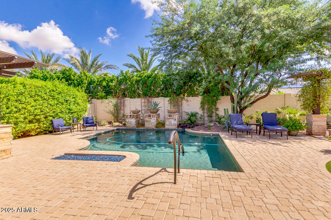 4647 North Aldea Road East Litchfield Park, AZ 85340 - Photo 38 of 49 a view of a backyard with sitting area