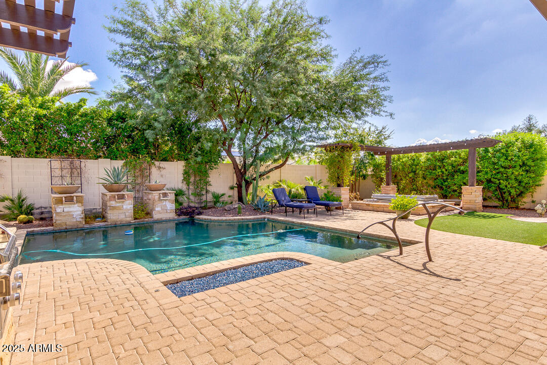 4647 North Aldea Road East Litchfield Park, AZ 85340 - Photo 39 of 49 a view of a swimming pool with a patio