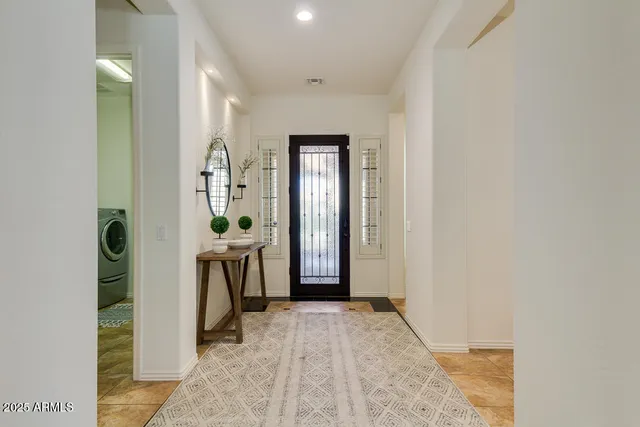 a view of a livingroom with furniture and windows