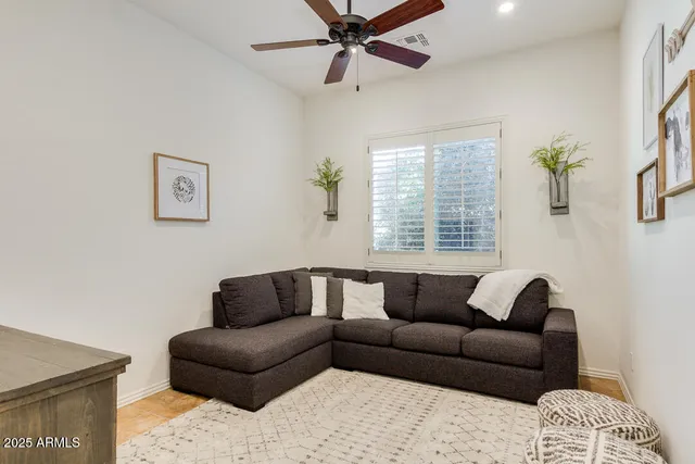 a living room with a table and chairs