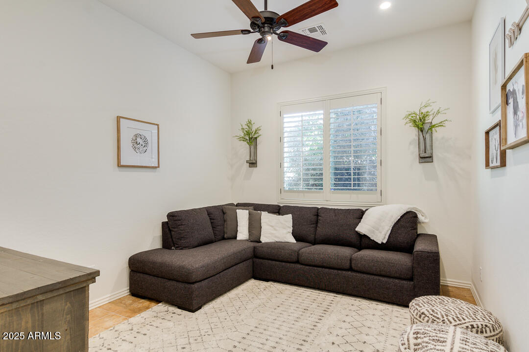 4647 North Aldea Road East Litchfield Park, AZ 85340 - Photo 9 of 49 a living room with furniture and a window