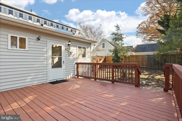 a view of a house with wooden deck