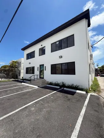 a front view of a building with lots of windows