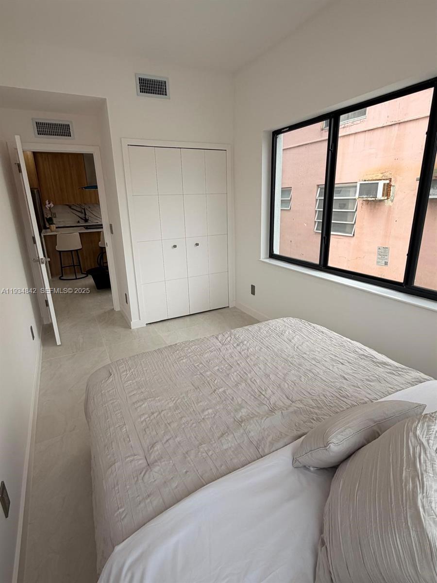 2436 Southwest 7th Street, Unit 3 Miami, FL 33135 - Photo 8 of 17 a living room with furniture and a window