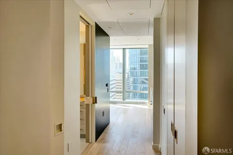 a view of large kitchen with wooden floor and windows