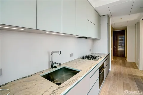 a view of front door with wooden floor