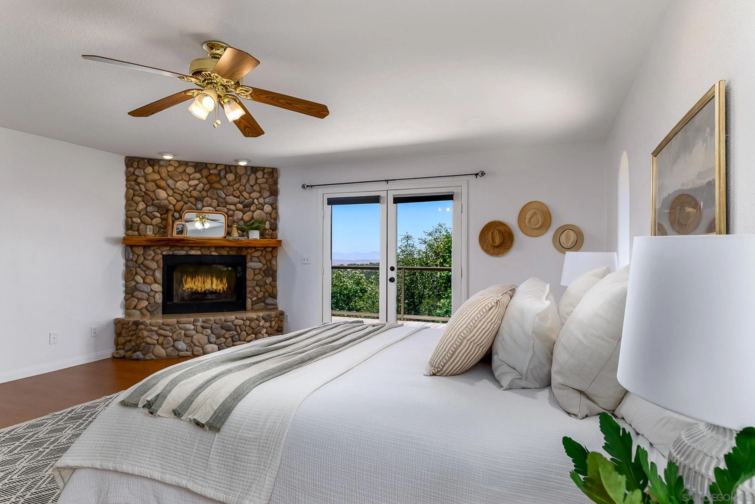 1577 Oak Land Road Julian, CA 92036 - Photo 6 of 73 Primary Bedroom with fireplace and french doors to deck