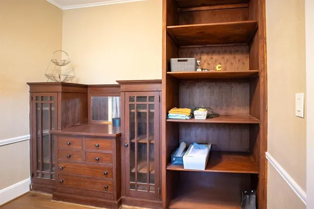 a kitchen with granite countertop a sink cabinets and stainless steel appliances
