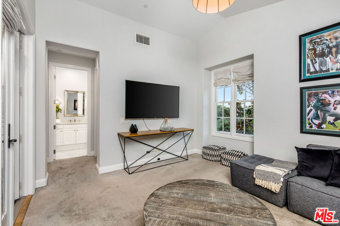 31 Pisano Street Ladera Ranch, CA 92694 - Photo 54 of 73 a living room with furniture and a flat screen tv