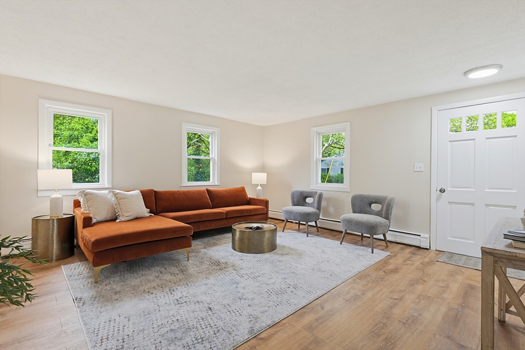 24 Otis Road Barnstable, MA 02601 - Photo 4 of 33 a living room with furniture and a window