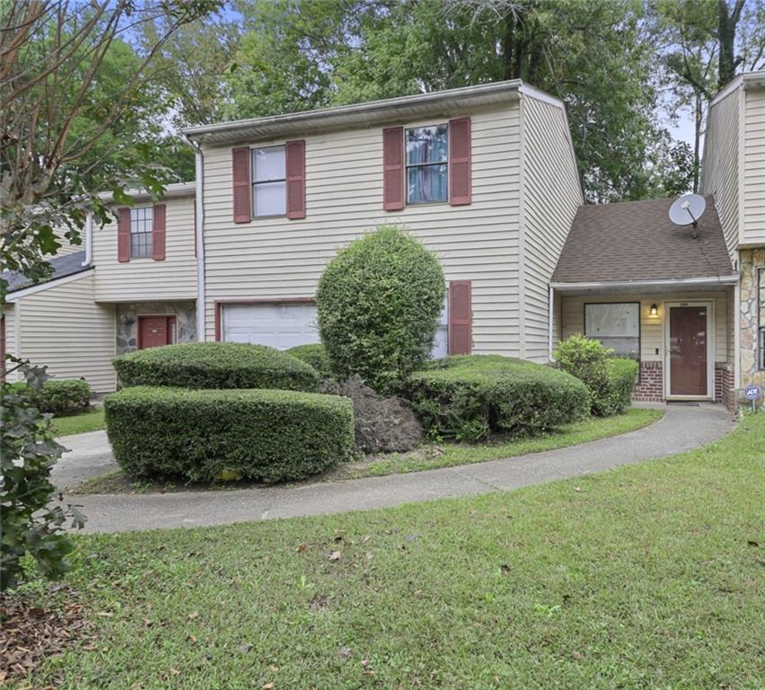a view of a house with a garden