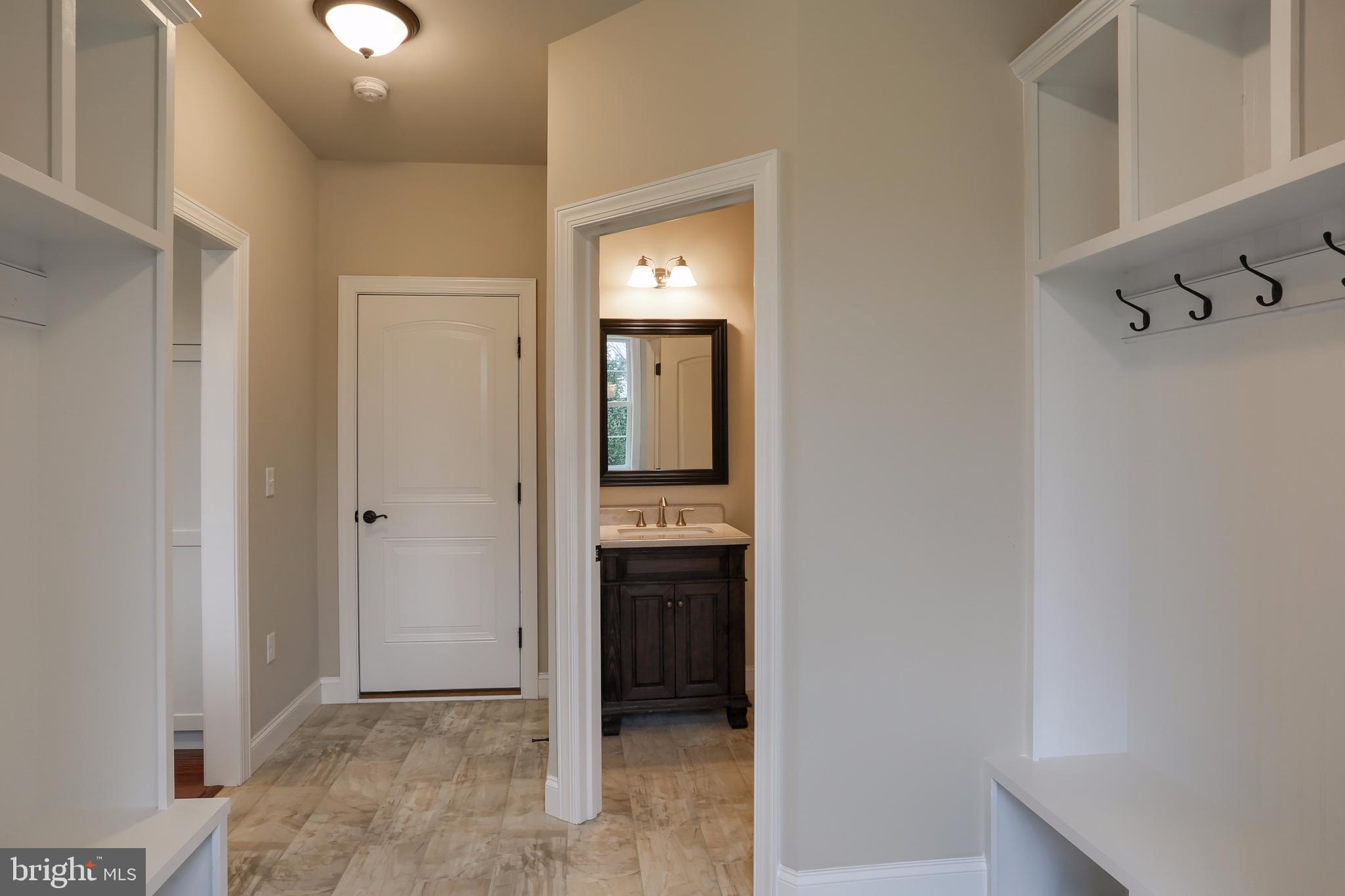 1033 Suffolk Drive Lititz, PA 17543 - Photo 24 of 45 Two bench and peg organizers for family members.