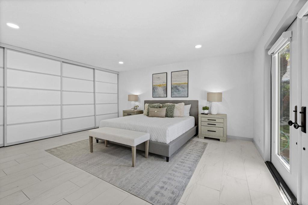 1561 Neptune Avenue Encinitas, CA 92024 - Photo 13 of 30 a bedroom with a bed and a window