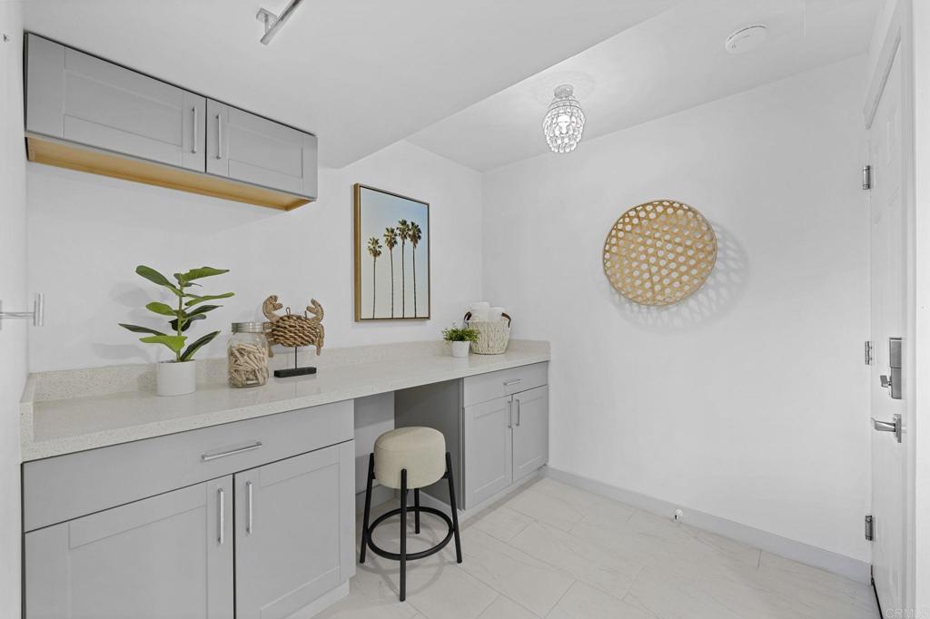 1561 Neptune Avenue Encinitas, CA 92024 - Photo 22 of 30 a view of cabinets a sink and a stove top oven