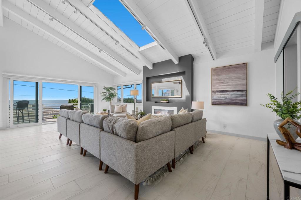 1561 Neptune Avenue Encinitas, CA 92024 - Photo 5 of 30 a living room with furniture and a potted plant