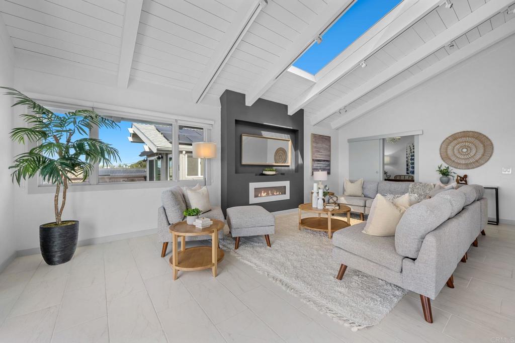 1561 Neptune Avenue Encinitas, CA 92024 - Photo 7 of 30 a living room with furniture and potted plants