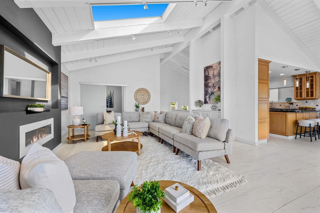 1561 Neptune Avenue Encinitas, CA 92024 - Photo 8 of 30 a living room with furniture and a fireplace