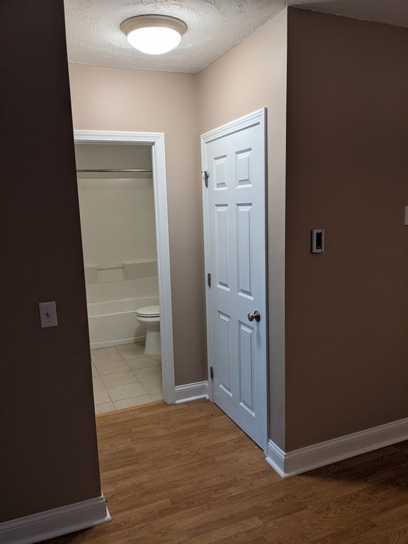 72 Leonard Road, Unit 72 Boxborough, MA 01719 - Photo 8 of 25 a view of a bathroom with wooden floor