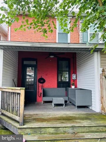 a view of pool area with seating area
