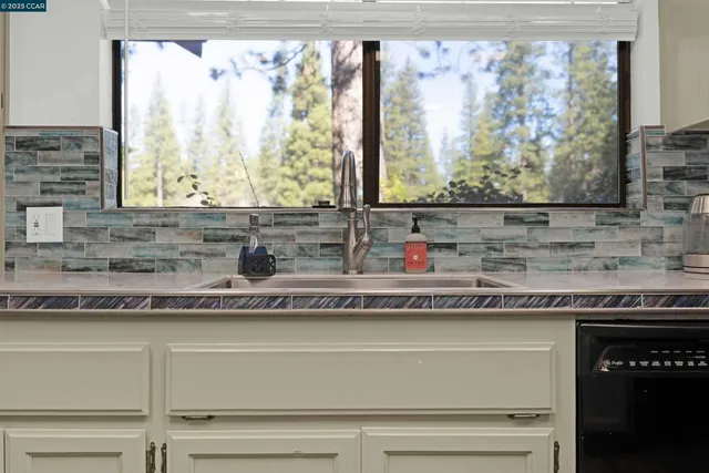 a en suite bathroom with a sink and a mirror