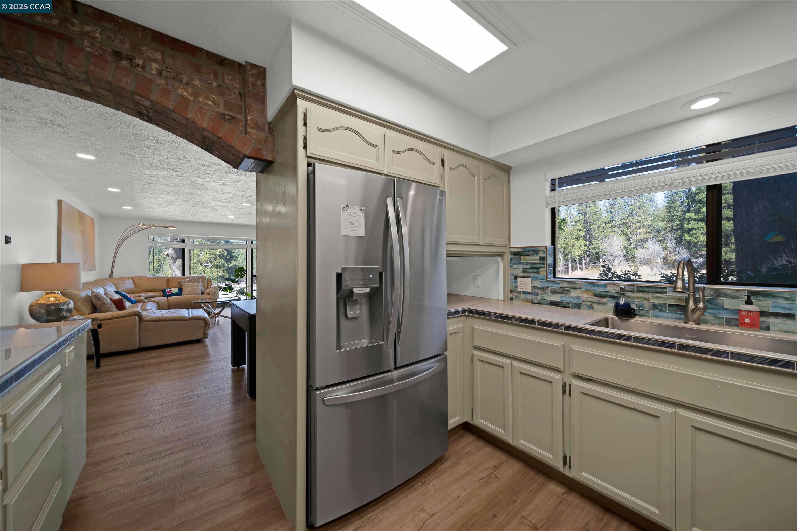 1324 Alves Road Weed, CA 96094 - Photo 13 of 58 a kitchen with a refrigerator and a sink
