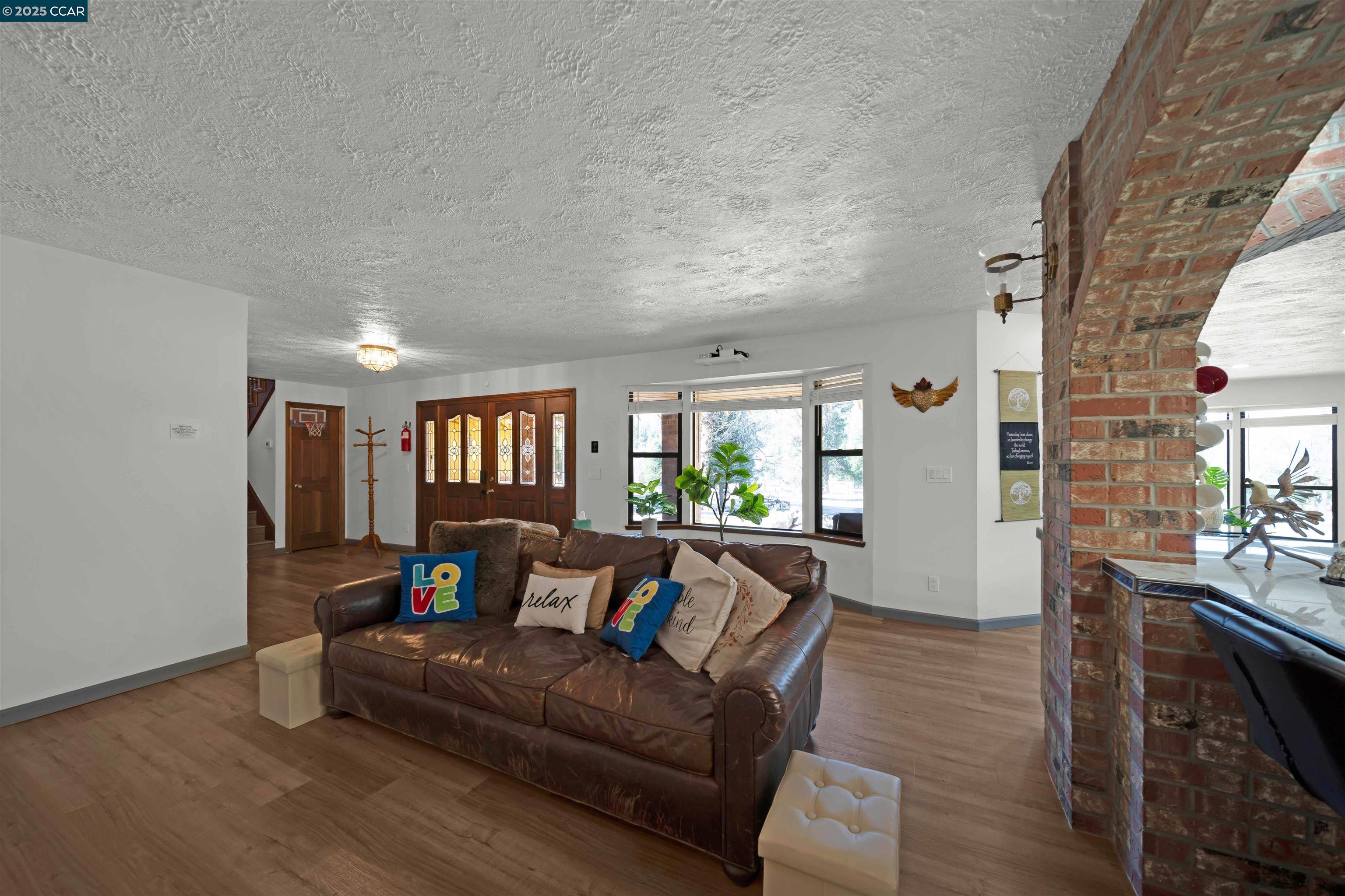 1324 Alves Road Weed, CA 96094 - Photo 16 of 58 a living room with furniture and a wooden floor
