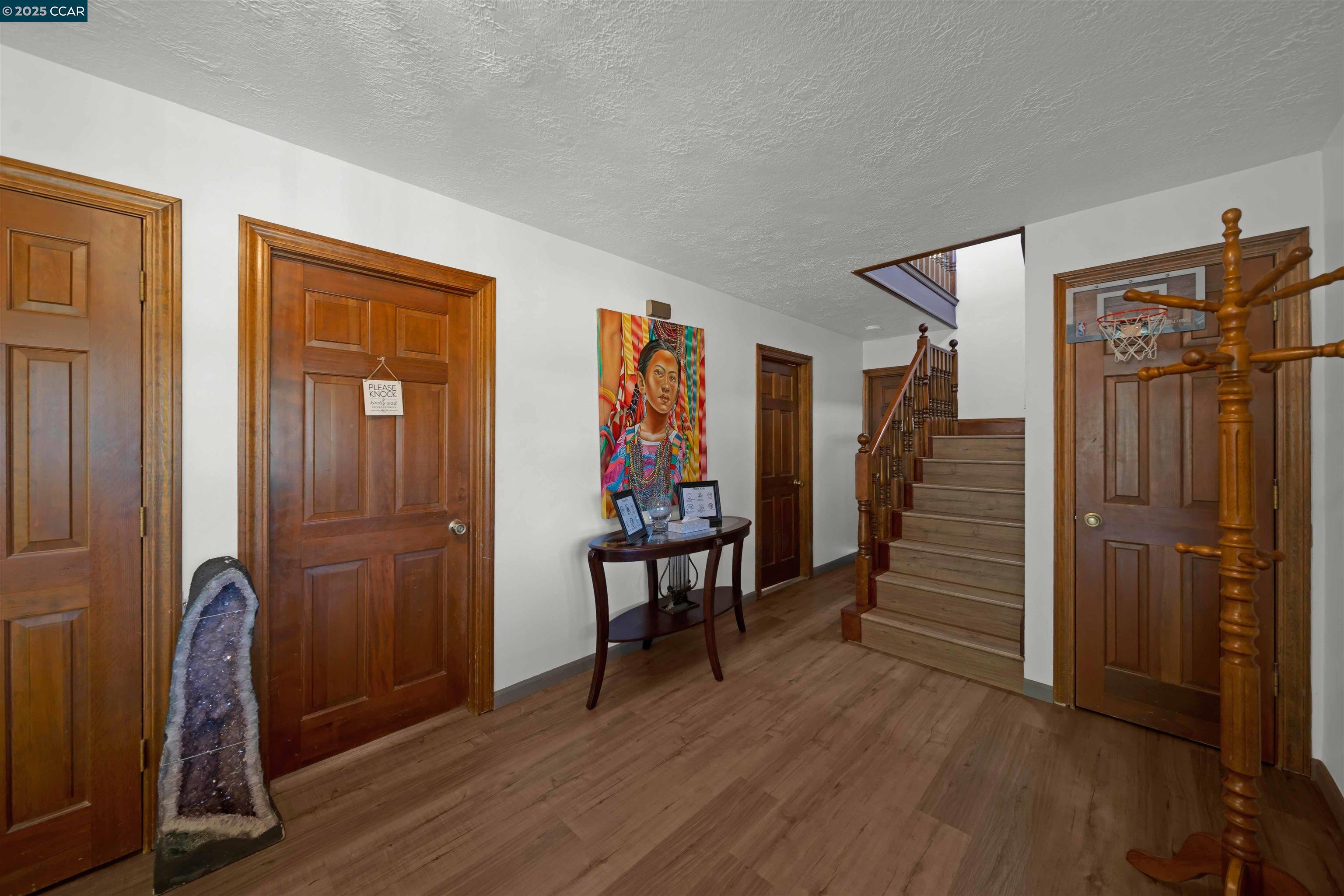 1324 Alves Road Weed, CA 96094 - Photo 21 of 58 a view of a hallway with wooden floor and stairs
