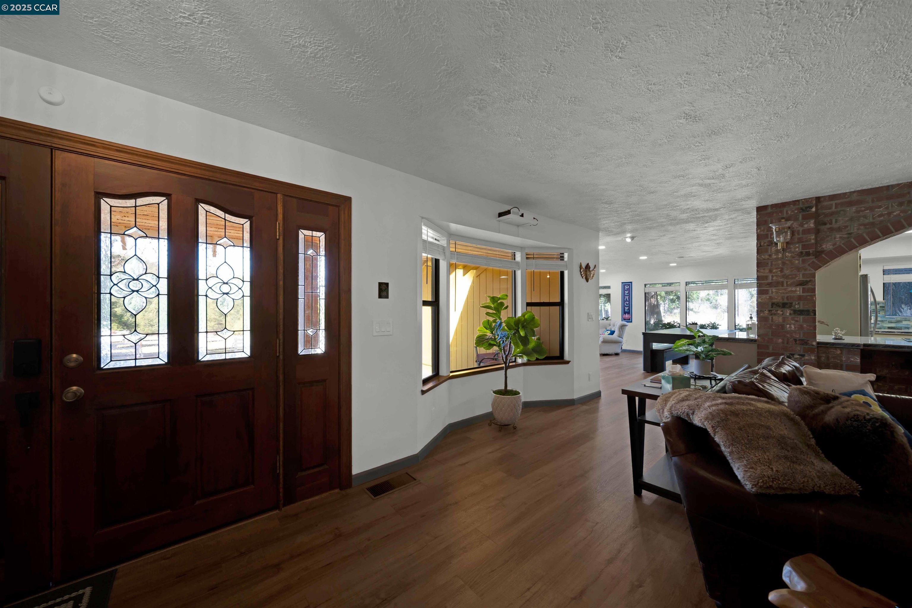 1324 Alves Road Weed, CA 96094 - Photo 22 of 58 a living room with furniture window and wooden floor