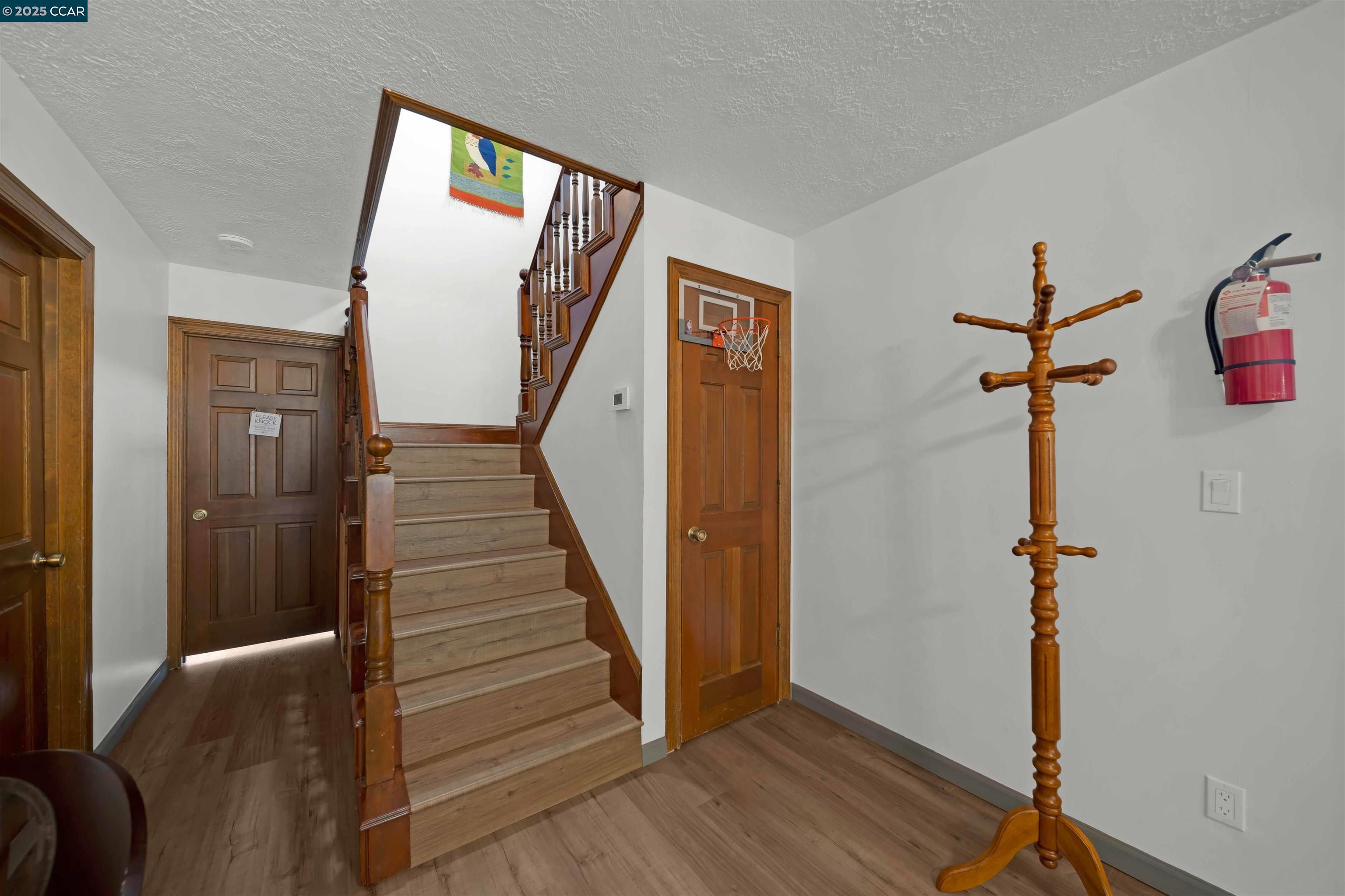 1324 Alves Road Weed, CA 96094 - Photo 24 of 58 a view of a hallway with wooden floor and stairs