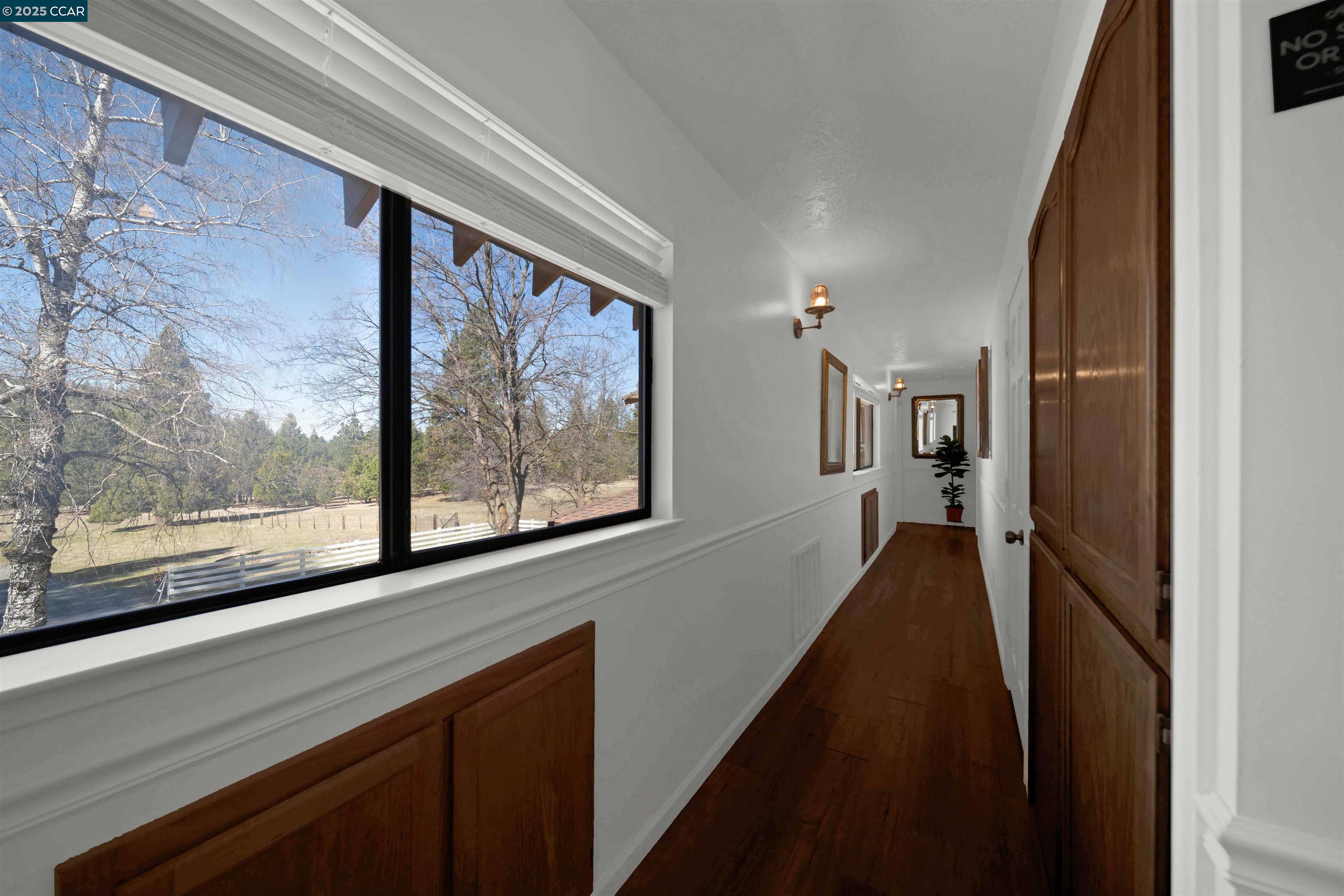 1324 Alves Road Weed, CA 96094 - Photo 36 of 58 a view of a hallway with wooden floor and staircase