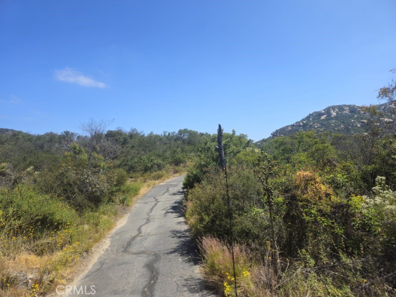 0 Sombrero Road Fallbrook, CA 92028 - Photo 13 of 16 a view of a street with a trees in the background