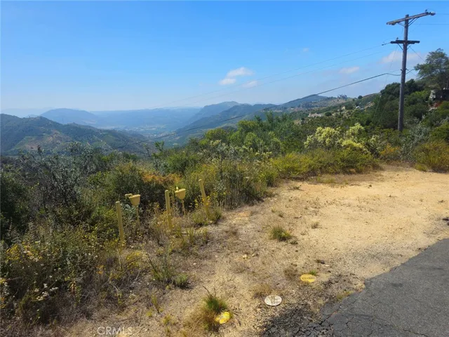 a view of a yard with a mountain