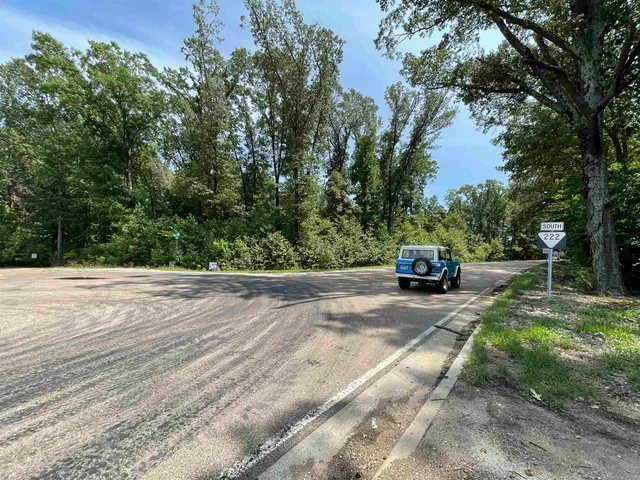 a view of a yard with car parked