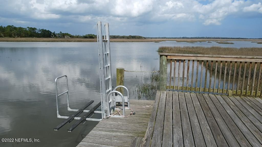 110 Historic Brick Lane St. Augustine, FL 32095 - Photo 4 of 4 a view of a balcony with chair and table