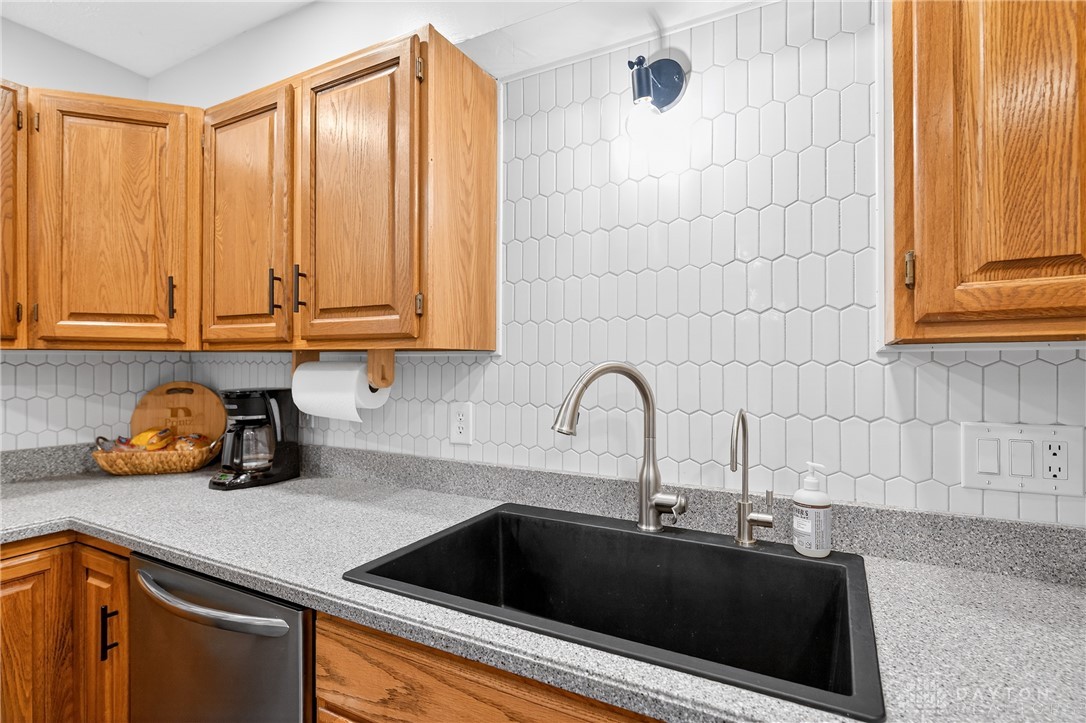 7888 Darke-Preble County Line Road Arcanum, OH 45304 - Photo 11 of 51 This modern kitchen features stylish cabinetry, a sleek sink, and contemporary backsplashes.