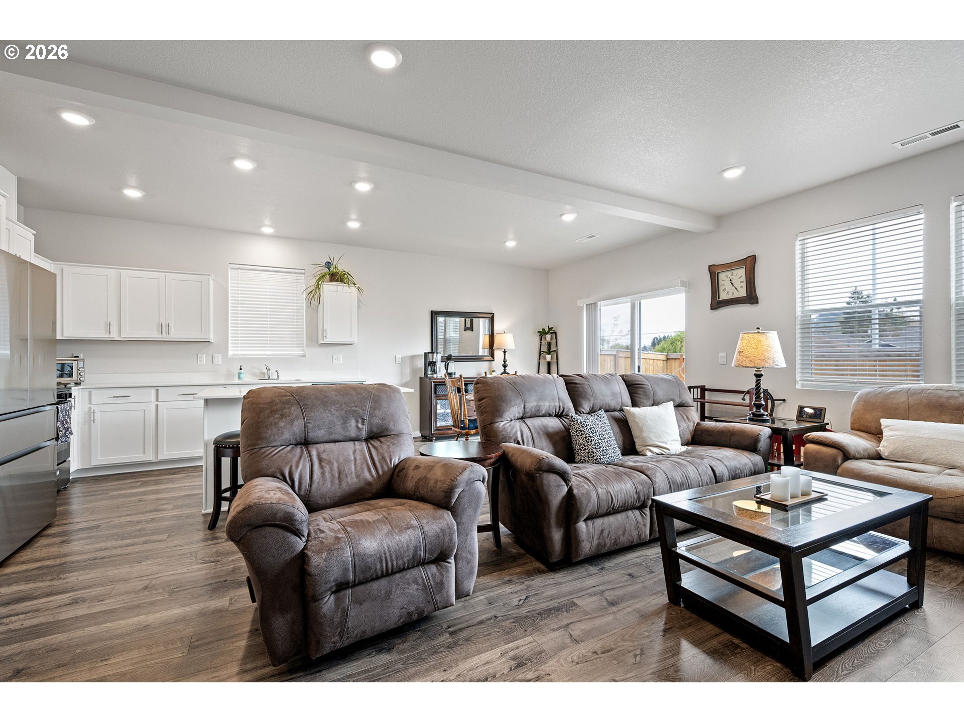 2259 30th Place Springfield, OR 97477 - Photo 14 of 48 a living room with furniture kitchen view and a wooden floor