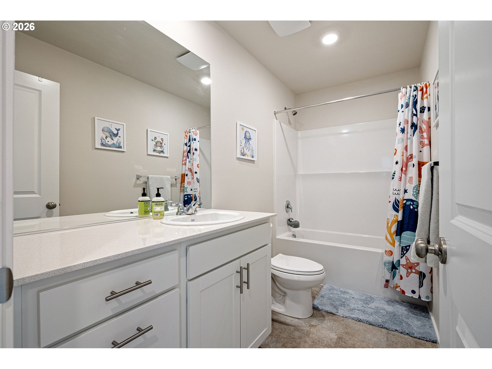 2259 30th Place Springfield, OR 97477 - Photo 27 of 48 a bathroom with a sink a toilet and a large mirror