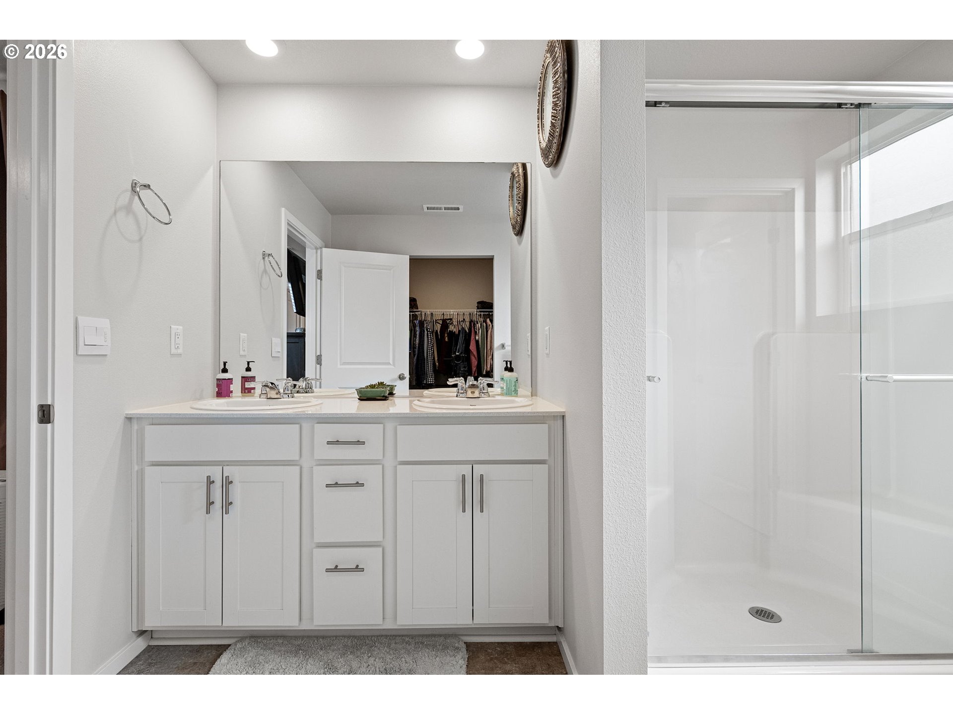 2259 30th Place Springfield, OR 97477 - Photo 35 of 48 a bathroom with a double vanity sink and a mirror