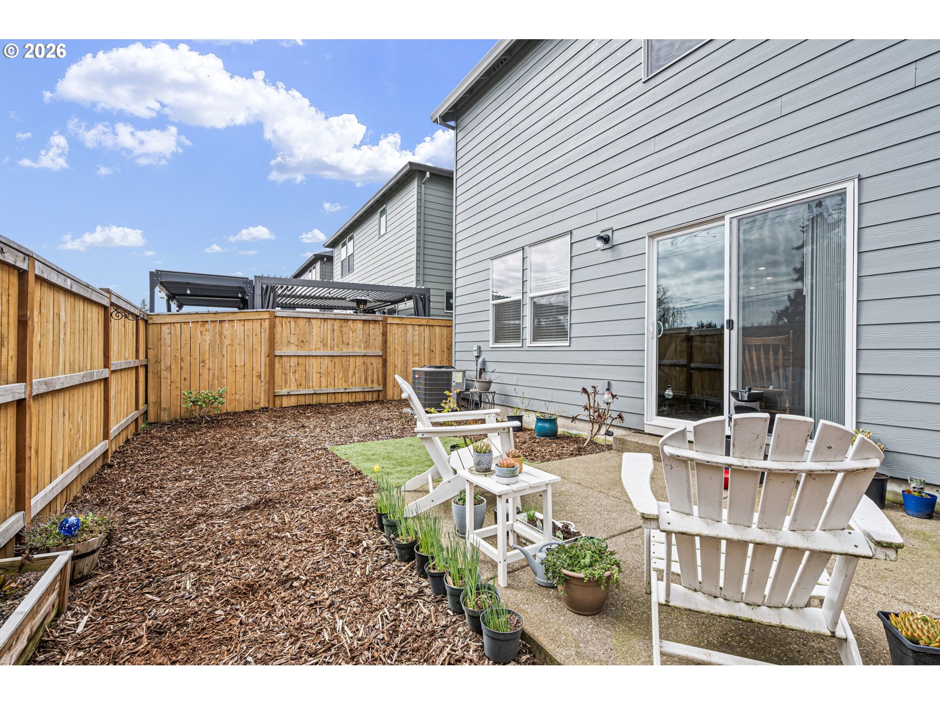 2259 30th Place Springfield, OR 97477 - Photo 47 of 48 a view of a patio with table and chairs and wooden floor