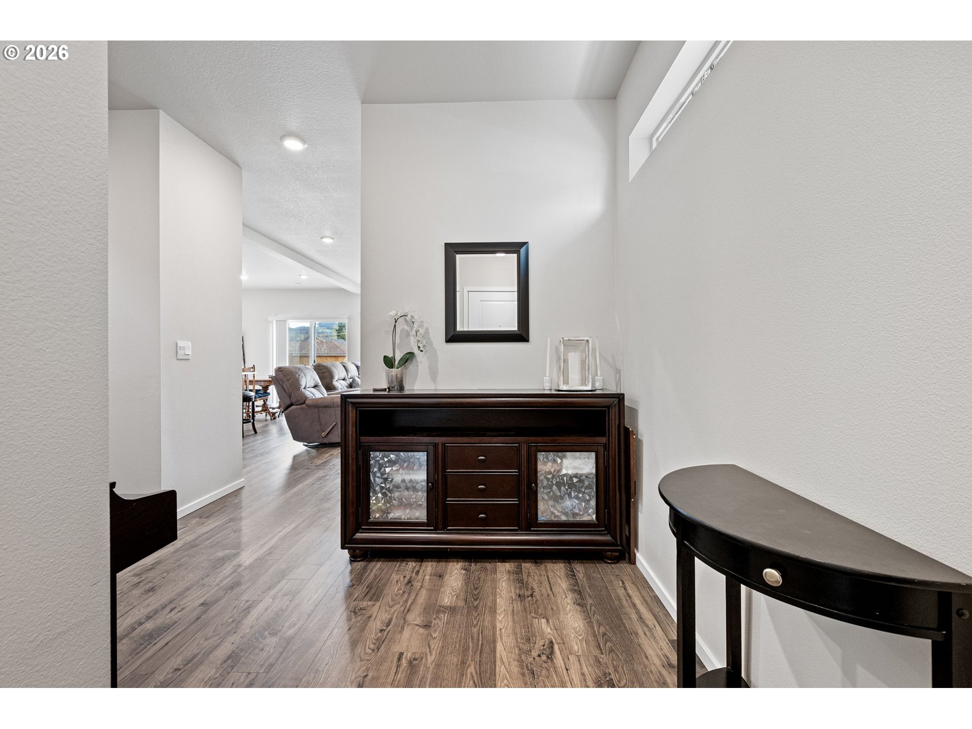 2259 30th Place Springfield, OR 97477 - Photo 5 of 48 a living room with a fireplace and a wooden floor